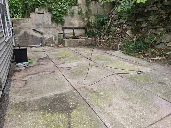 a view of backyard with garage