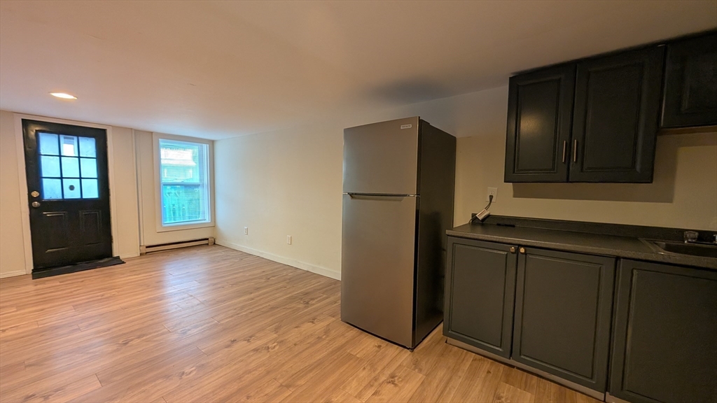 86 West Main Street North Adams, MA 01247 - Photo 5 of 35 a kitchen with a refrigerator and a sink