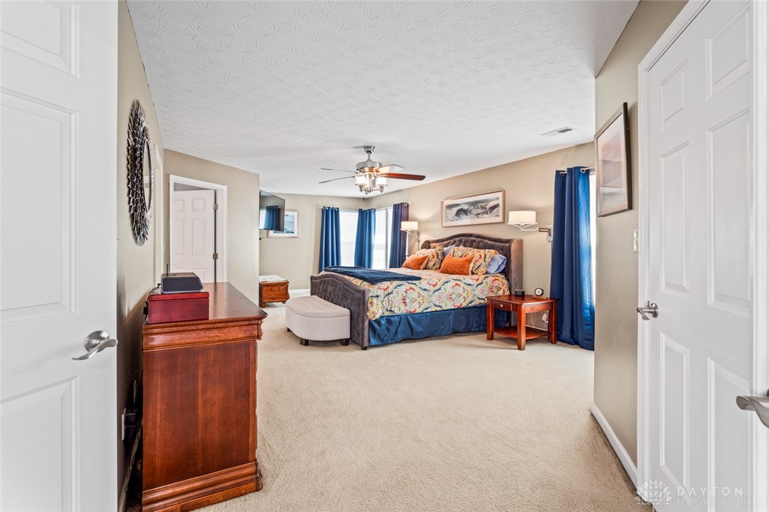55 Janney Lane Springboro, OH 45066 - Photo 24 of 38 This spacious primary bedroom offers comfort and ample room for relaxation.