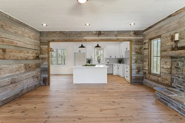 a view of kitchen with furniture and wooden floor
