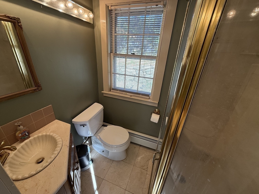 227 Boston Road Groton, MA 01450 - Photo 15 of 42 a bathroom with a sink and a toilet