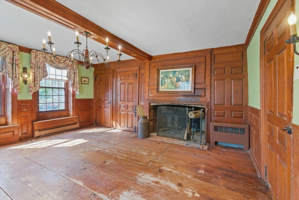 227 Boston Road Groton, MA 01450 - Photo 20 of 42 a view of an empty room with a fireplace and a window