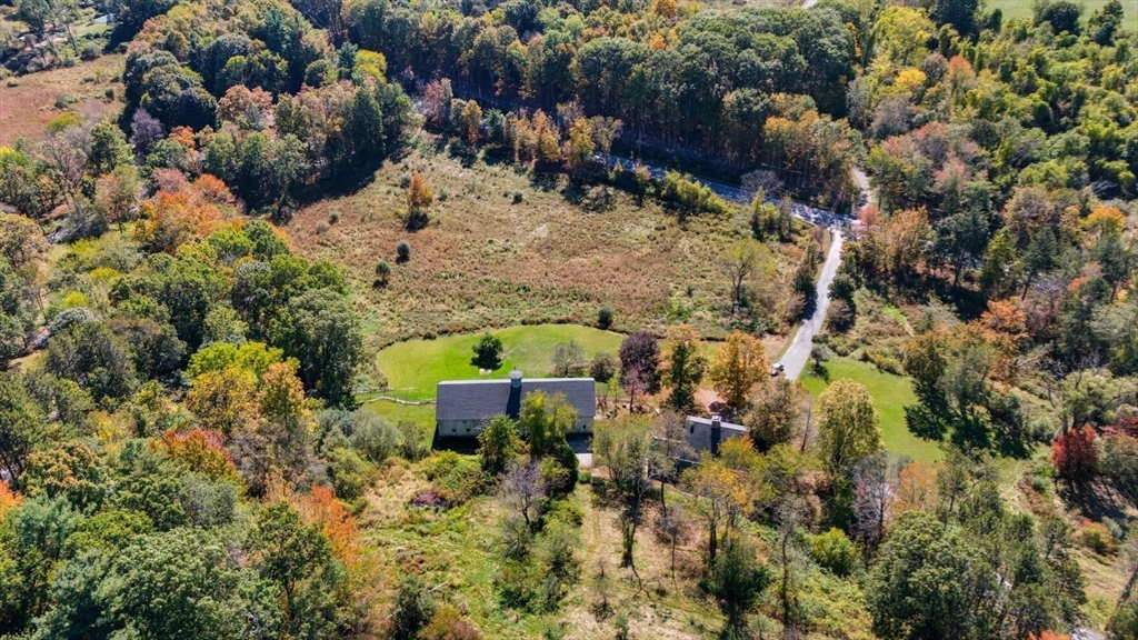 227 Boston Road Groton, MA 01450 - Photo 3 of 42 a view of a yard with plants