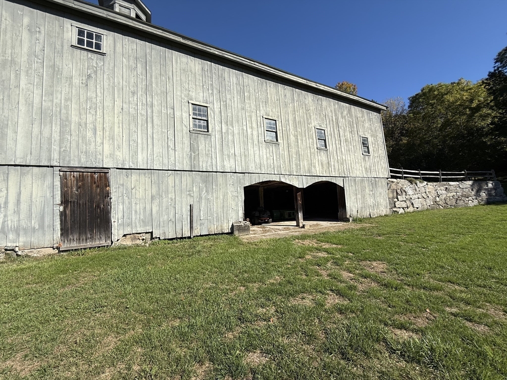 227 Boston Road Groton, MA 01450 - Photo 8 of 42 a view of a back yard of the house