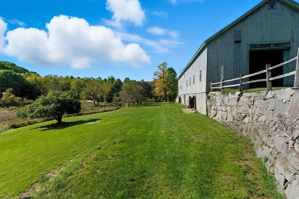 227 Boston Road Groton, MA 01450 - Photo 9 of 42 a view of an house with backyard space and garden
