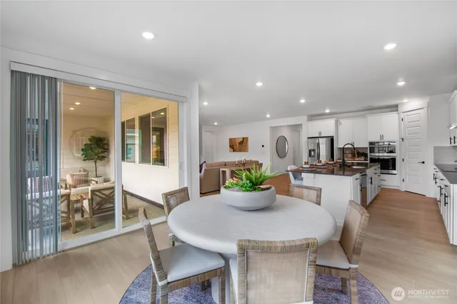 a kitchen with a table and chairs