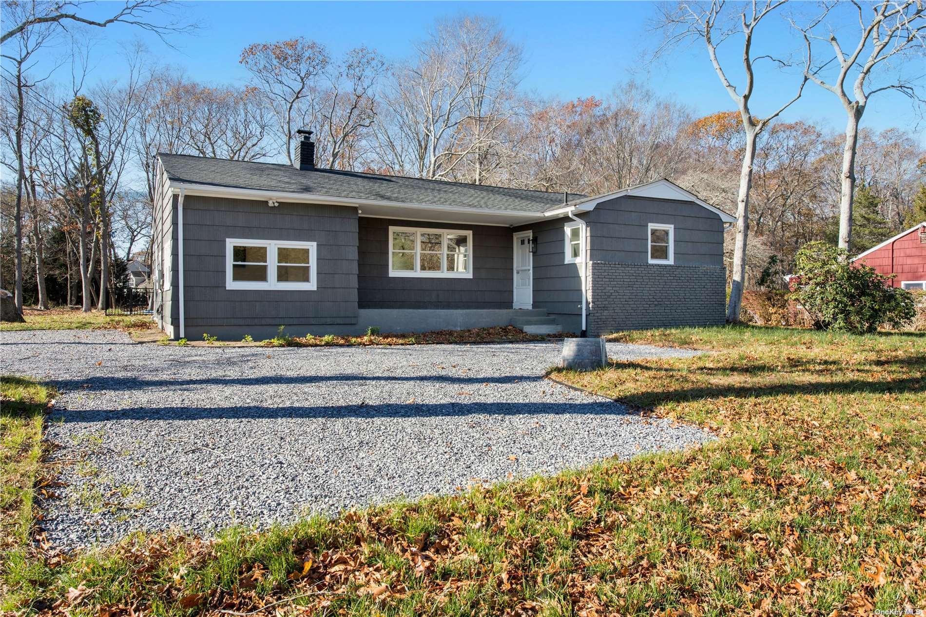 1475 Cox Neck Road Mattituck, NY 11952 - Photo 1 of 1 a front view of a house with a yard