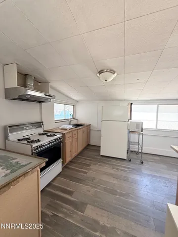 a kitchen with a stove and a refrigerator