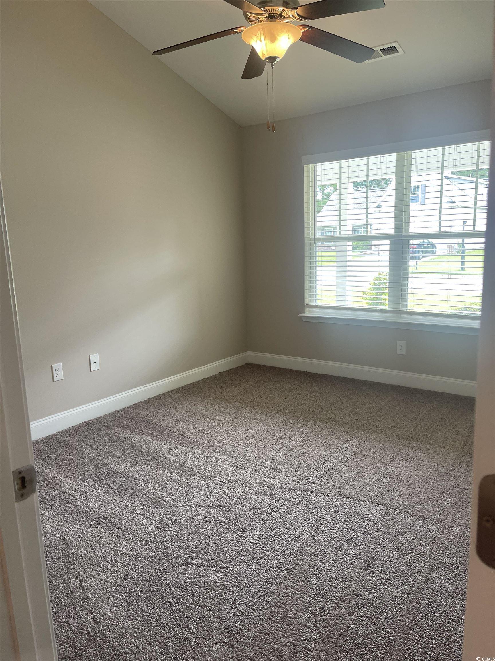 128 Cloey Road Myrtle Beach, SC 29579 - Photo 5 of 22 Carpeted empty room featuring baseboards and ceiling fan