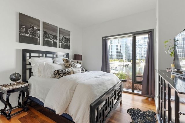 a bedroom with double bed and a window