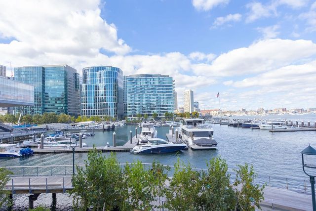 a view of a lake with tall buildings