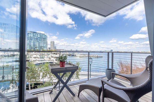 a view of a balcony with chair and table