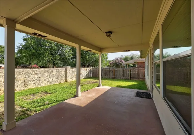 a view of a backyard with small cabin