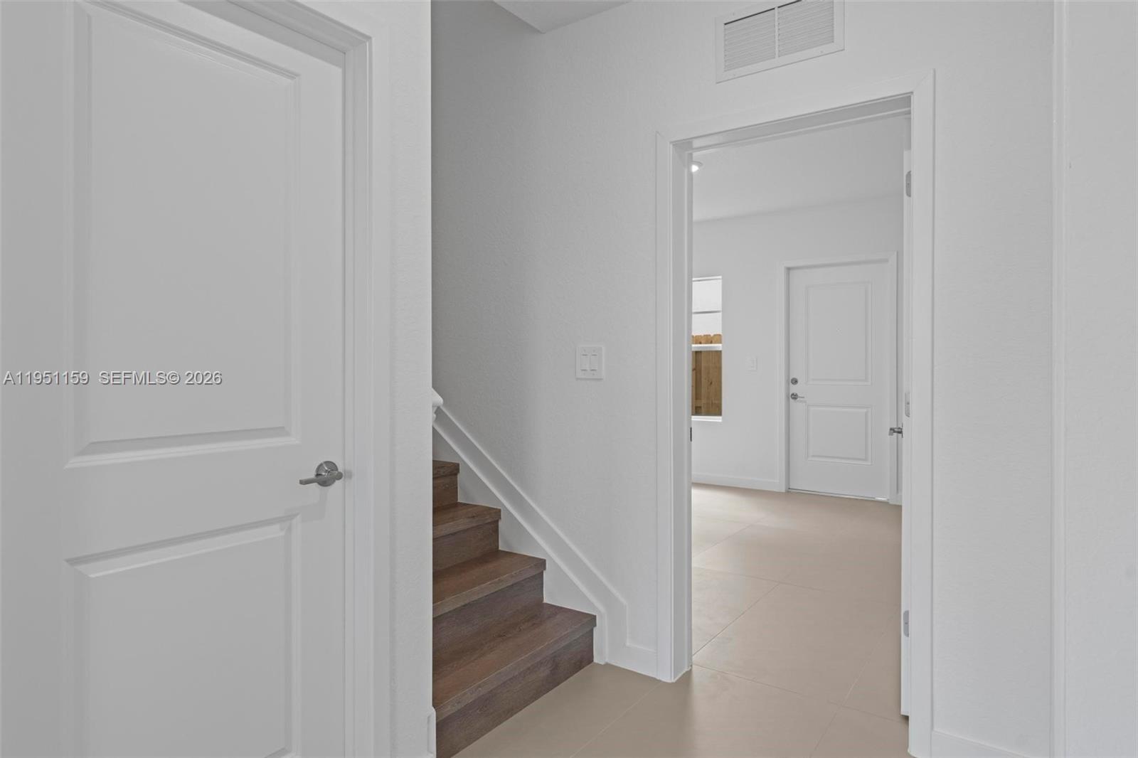 13355 Southwest 272nd Lane Homestead, FL 33032 - Photo 19 of 35 a view of a hallway with staircase