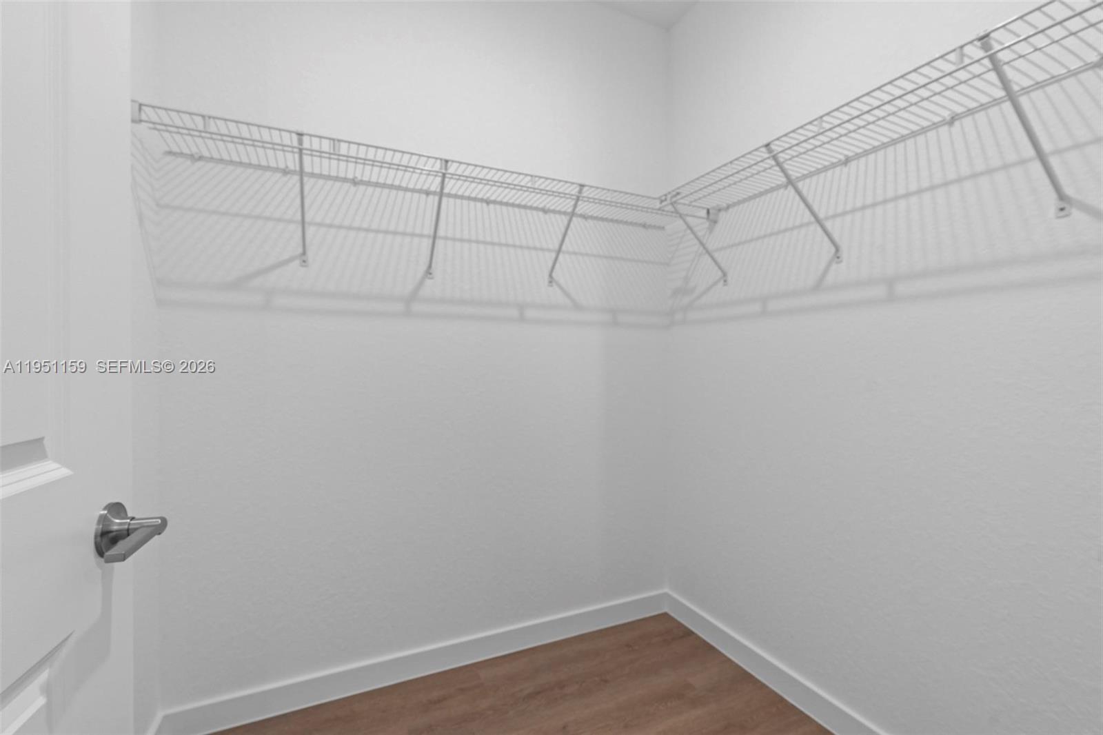 13355 Southwest 272nd Lane Homestead, FL 33032 - Photo 33 of 35 a view of a room with racks on the wall