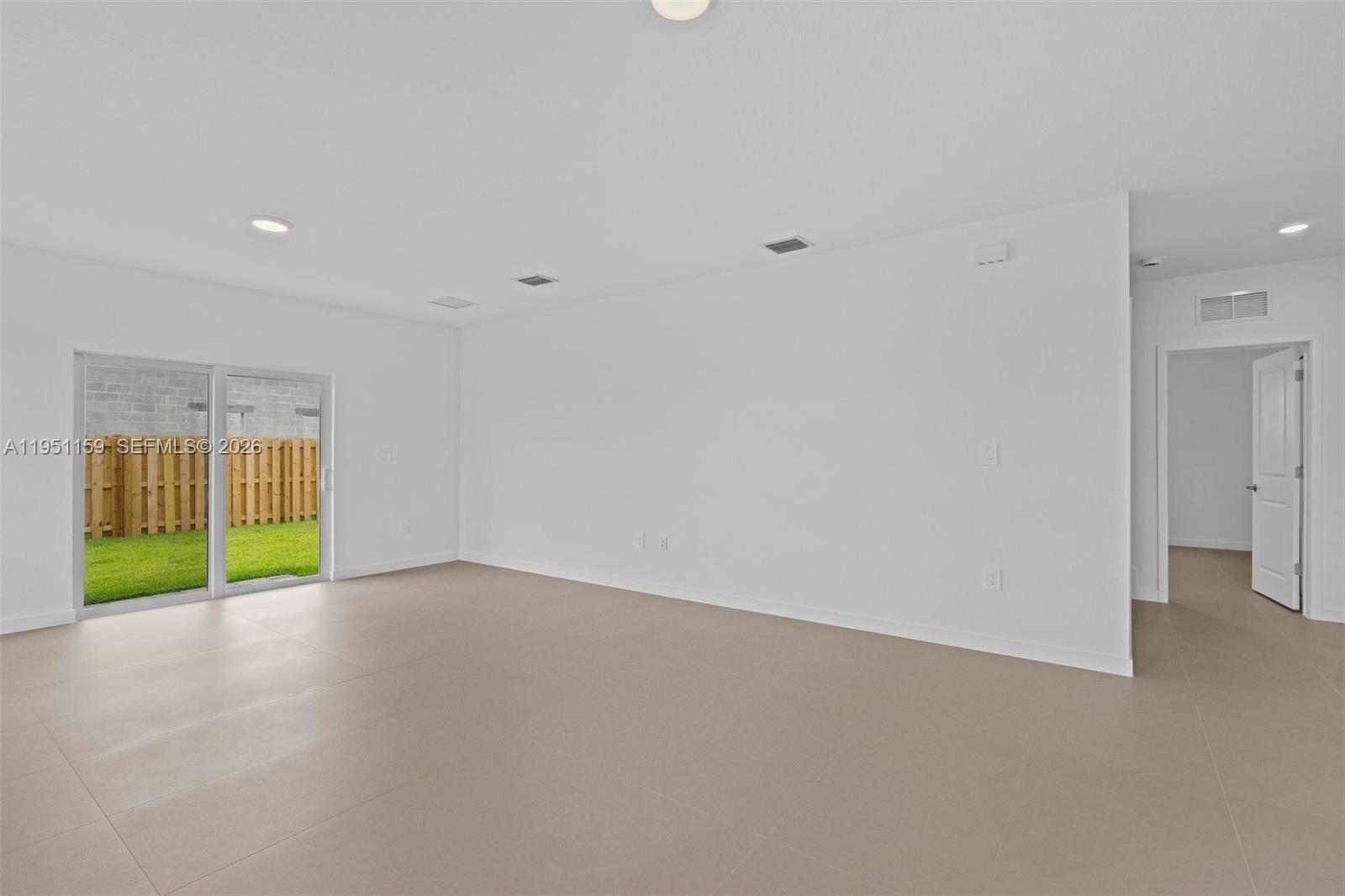 13355 Southwest 272nd Lane Homestead, FL 33032 - Photo 8 of 35 a view of an empty room with a window