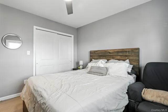 a bedroom with a bed and chair