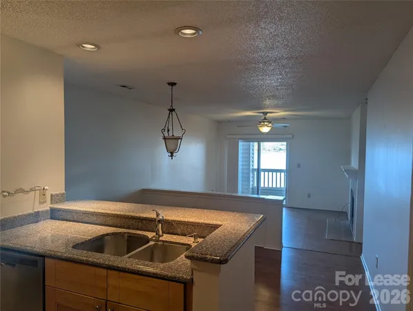 a kitchen that has a sink and a window