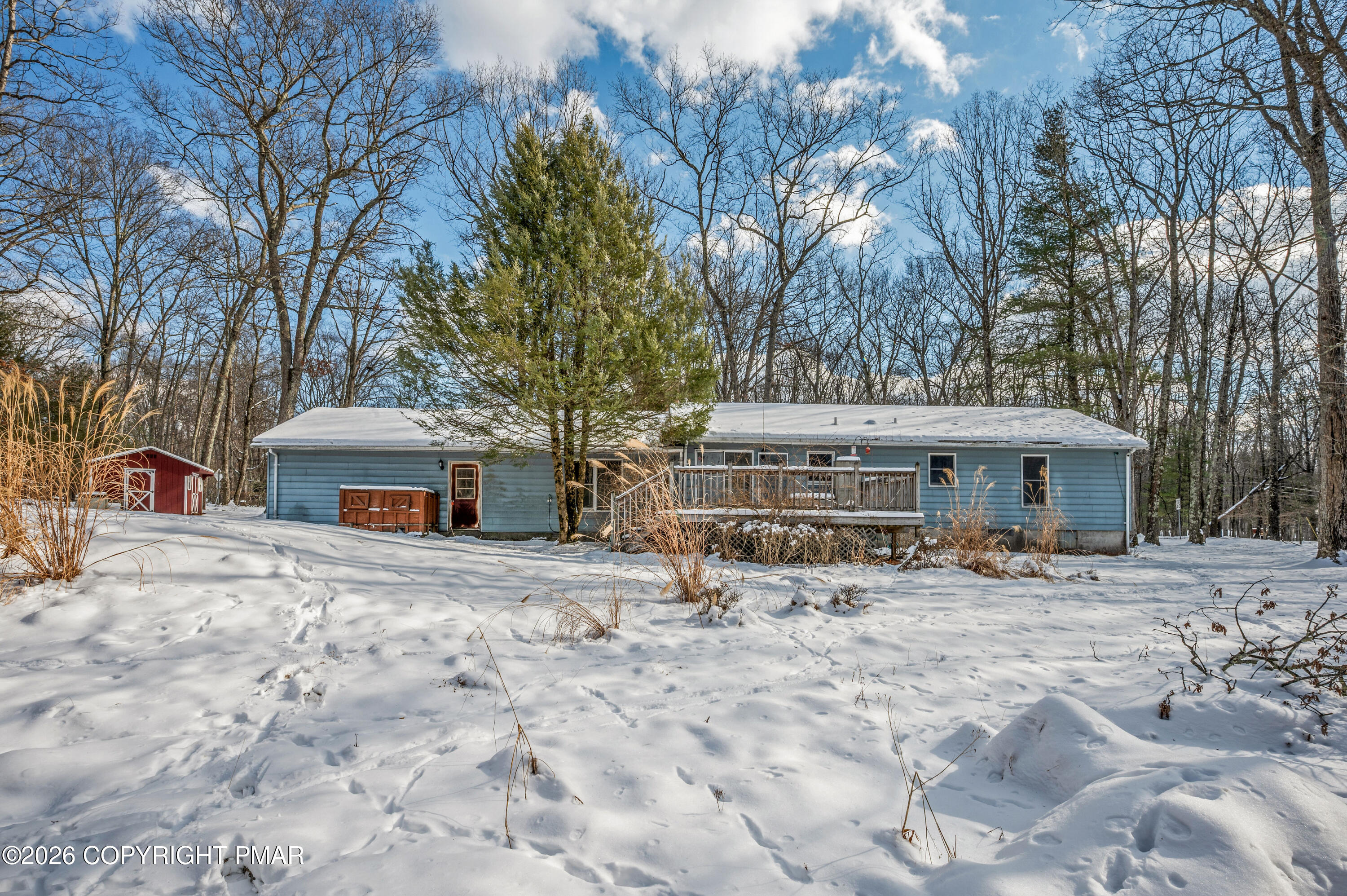 401 Schoolhouse Road East Stroudsburg, PA 18302 - Photo 1 of 21 a view of a house with a yard covered in snow