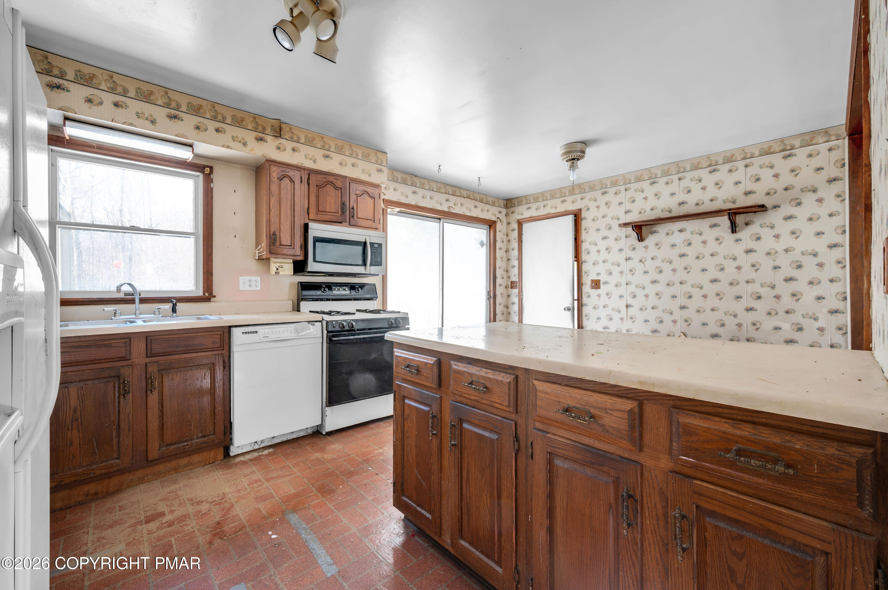 401 Schoolhouse Road East Stroudsburg, PA 18302 - Photo 8 of 21 a kitchen with stainless steel appliances a sink stove and cabinets