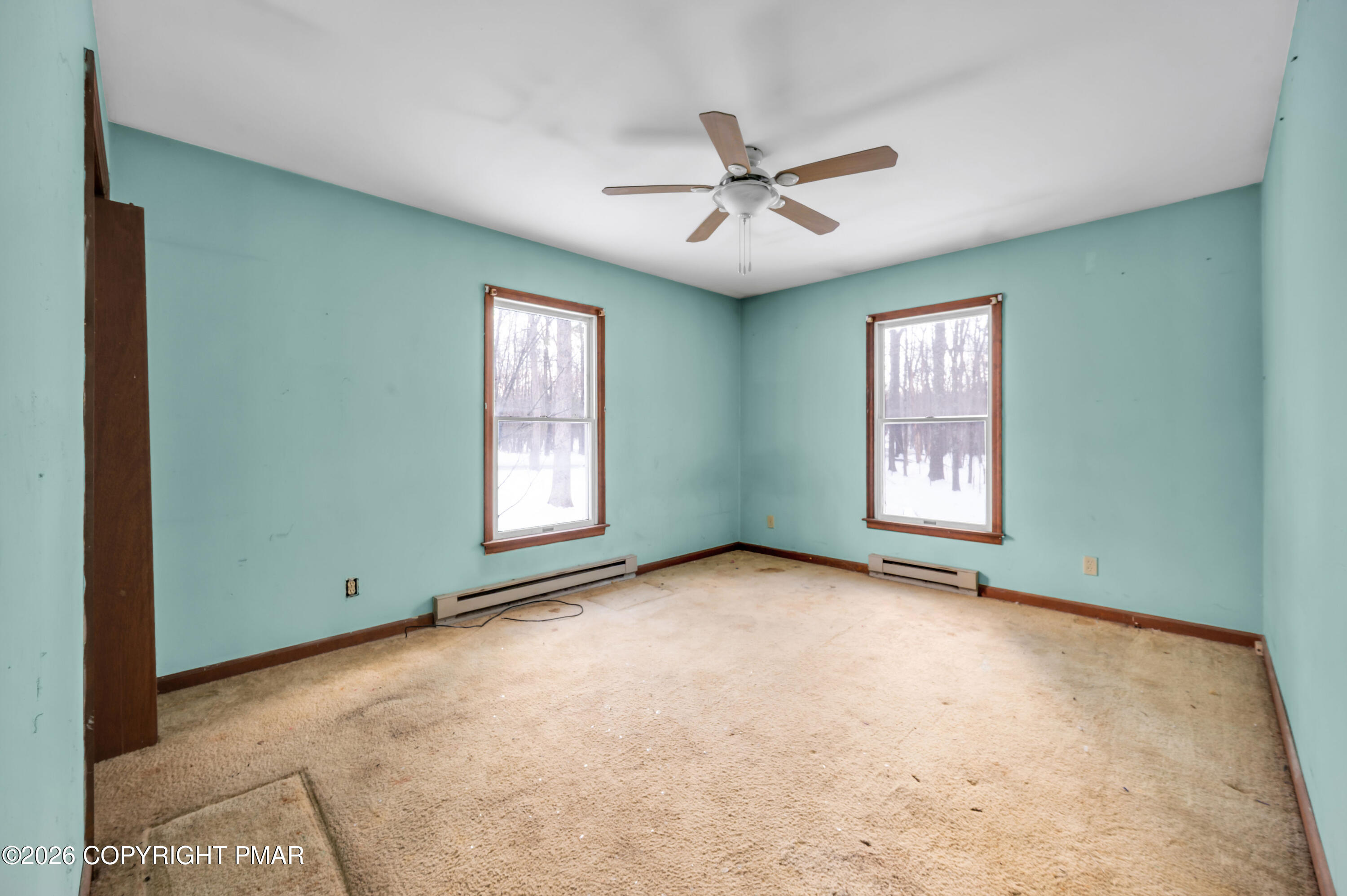 401 Schoolhouse Road East Stroudsburg, PA 18302 - Photo 9 of 21 an empty room with windows and fan