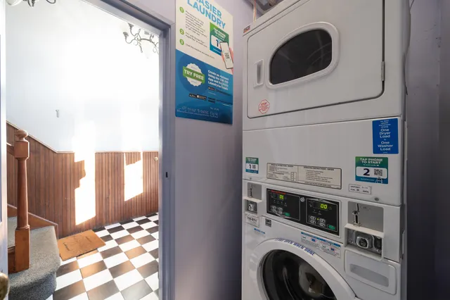 front view of a house with a tree