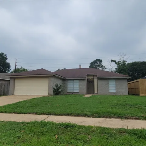 a view of a house with a sink and a yard