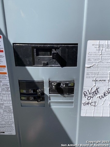 155 Pr 1513 Bandera, TX 78003 - Photo 5 of 10 a kitchen with a stove and white cabinets