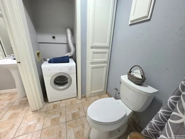 a bathroom with a toilet and a sink