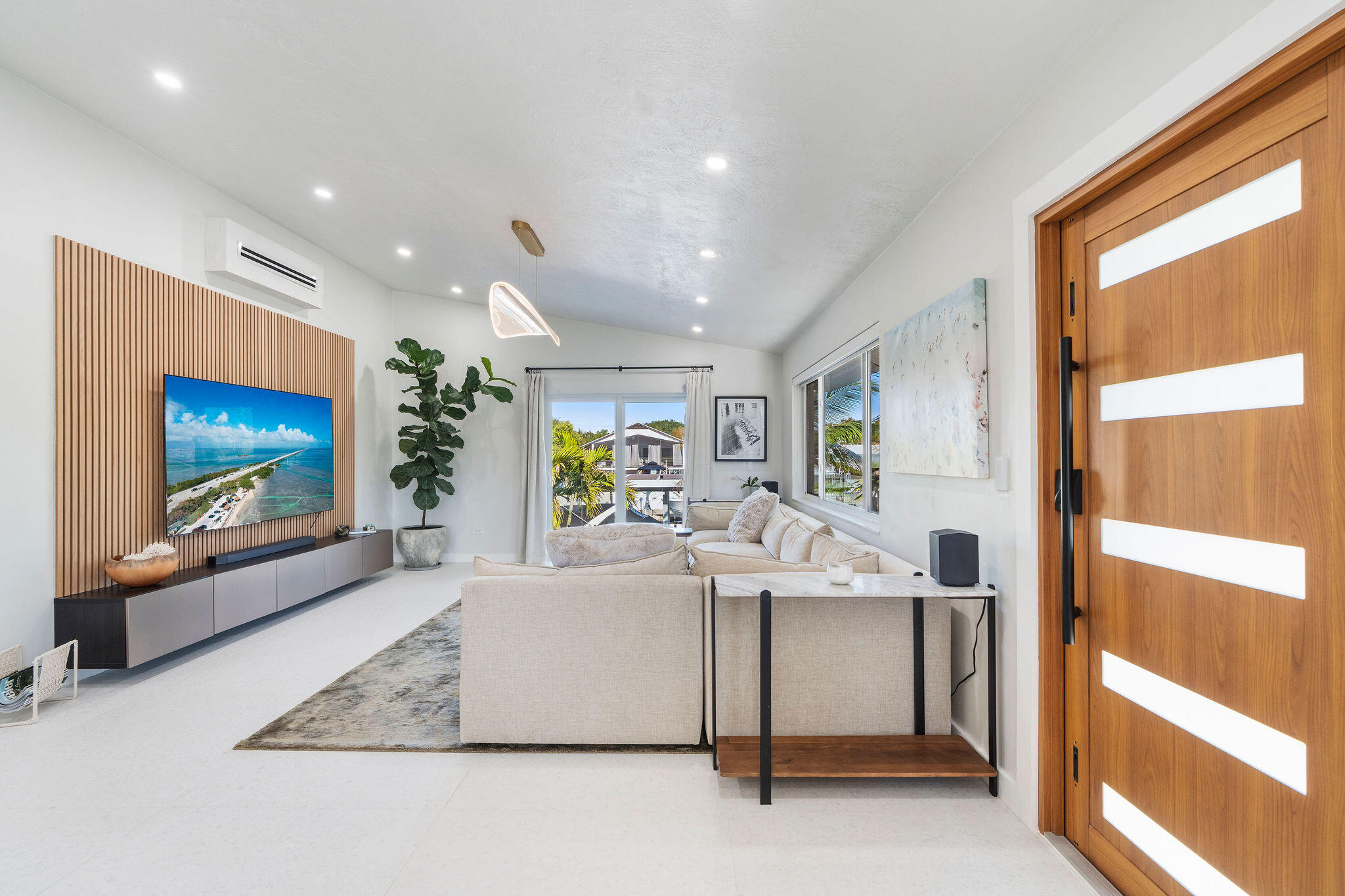 974 Shaw Drive Key Largo, FL 33037 - Photo 11 of 84 a view of a living room and a flat screen tv