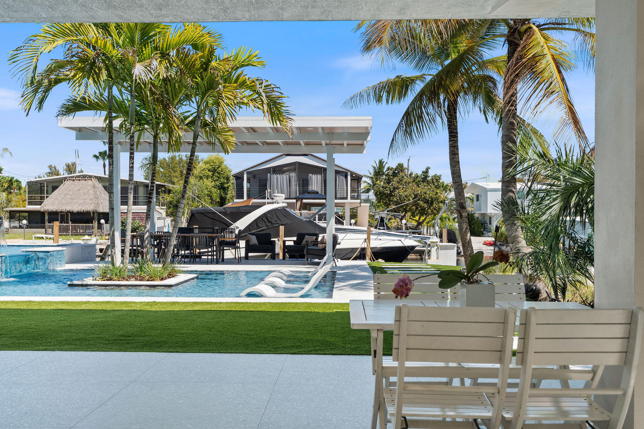 974 Shaw Drive Key Largo, FL 33037 - Photo 50 of 84 a front view of a house with a garden