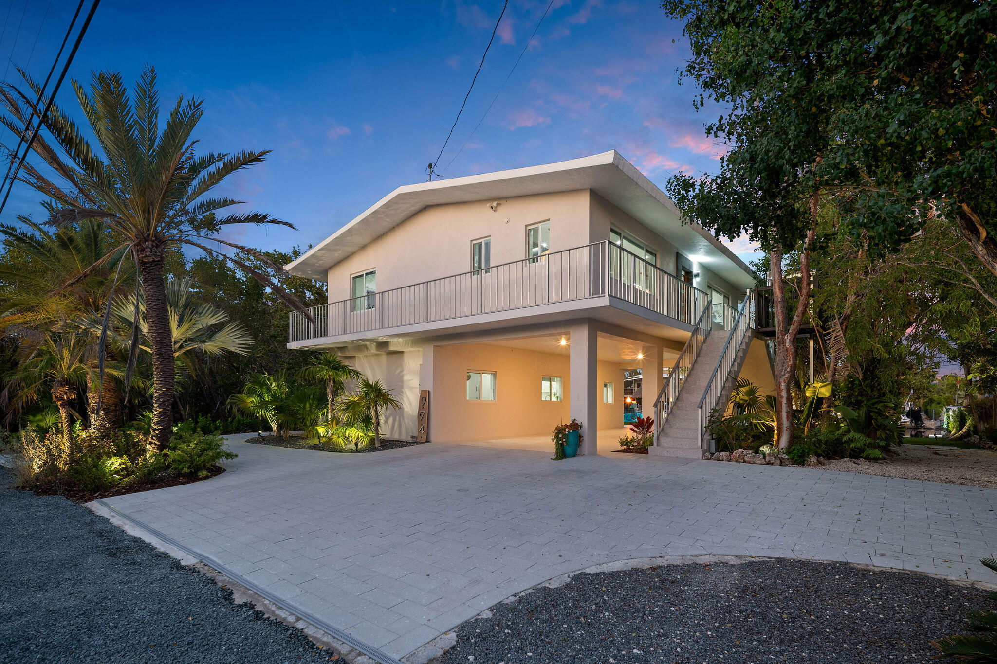974 Shaw Drive Key Largo, FL 33037 - Photo 6 of 84 a front view of a house with a yard