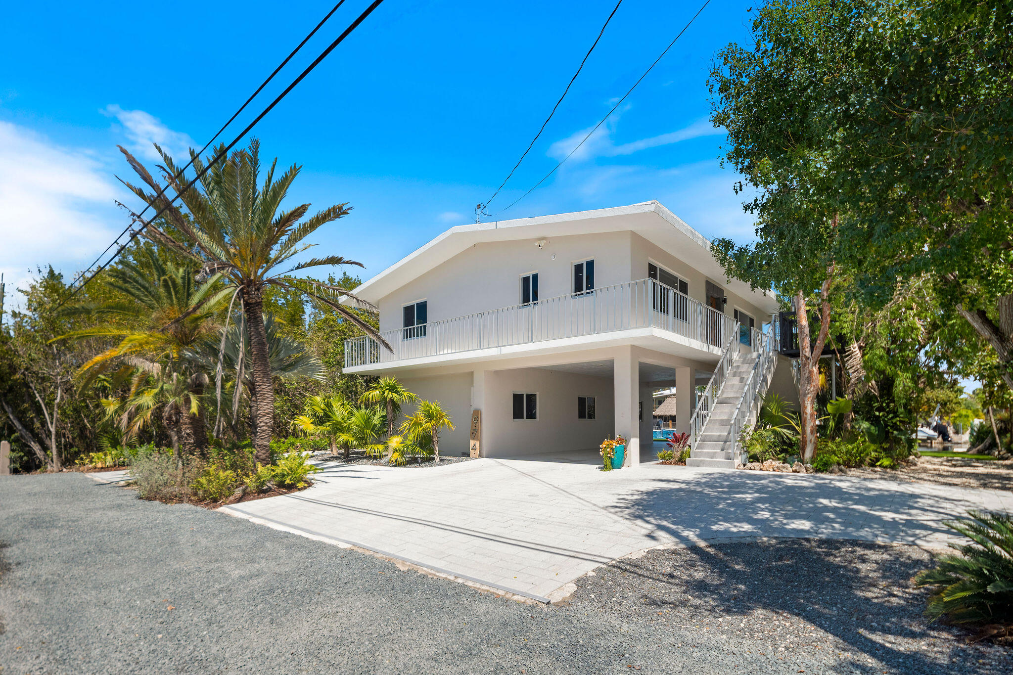 974 Shaw Drive Key Largo, FL 33037 - Photo 67 of 84 a front view of a house with a yard