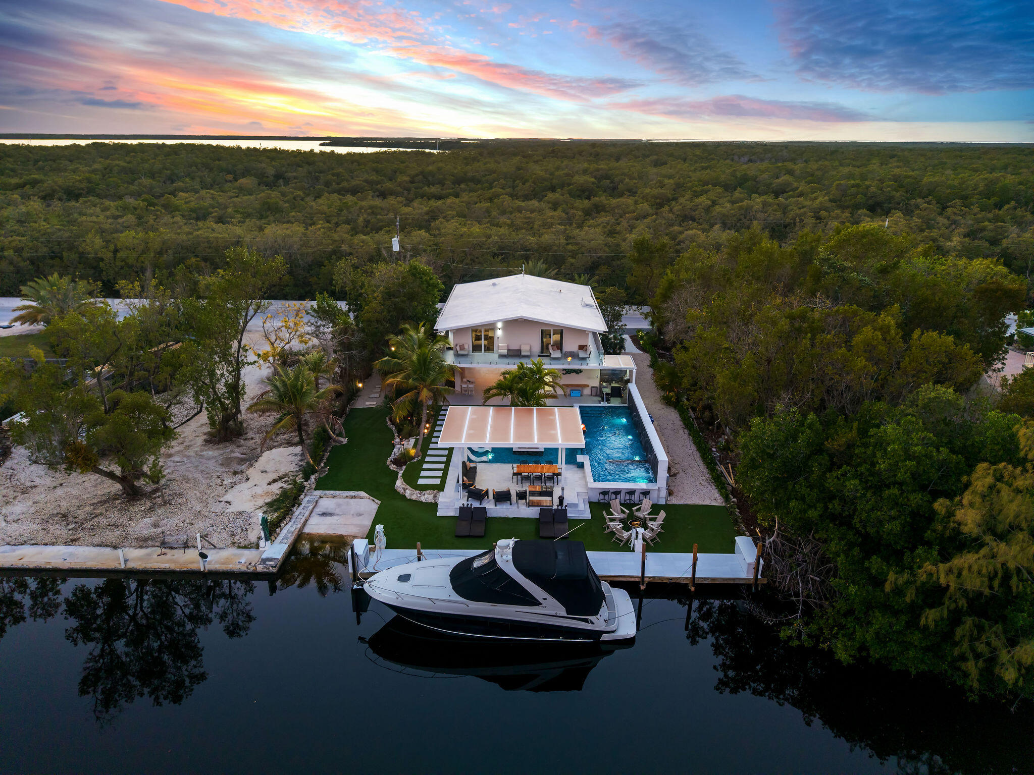 974 Shaw Drive Key Largo, FL 33037 - Photo 75 of 84 a aerial view of a house with a yard swimming pool outdoor seating yard and mountain view