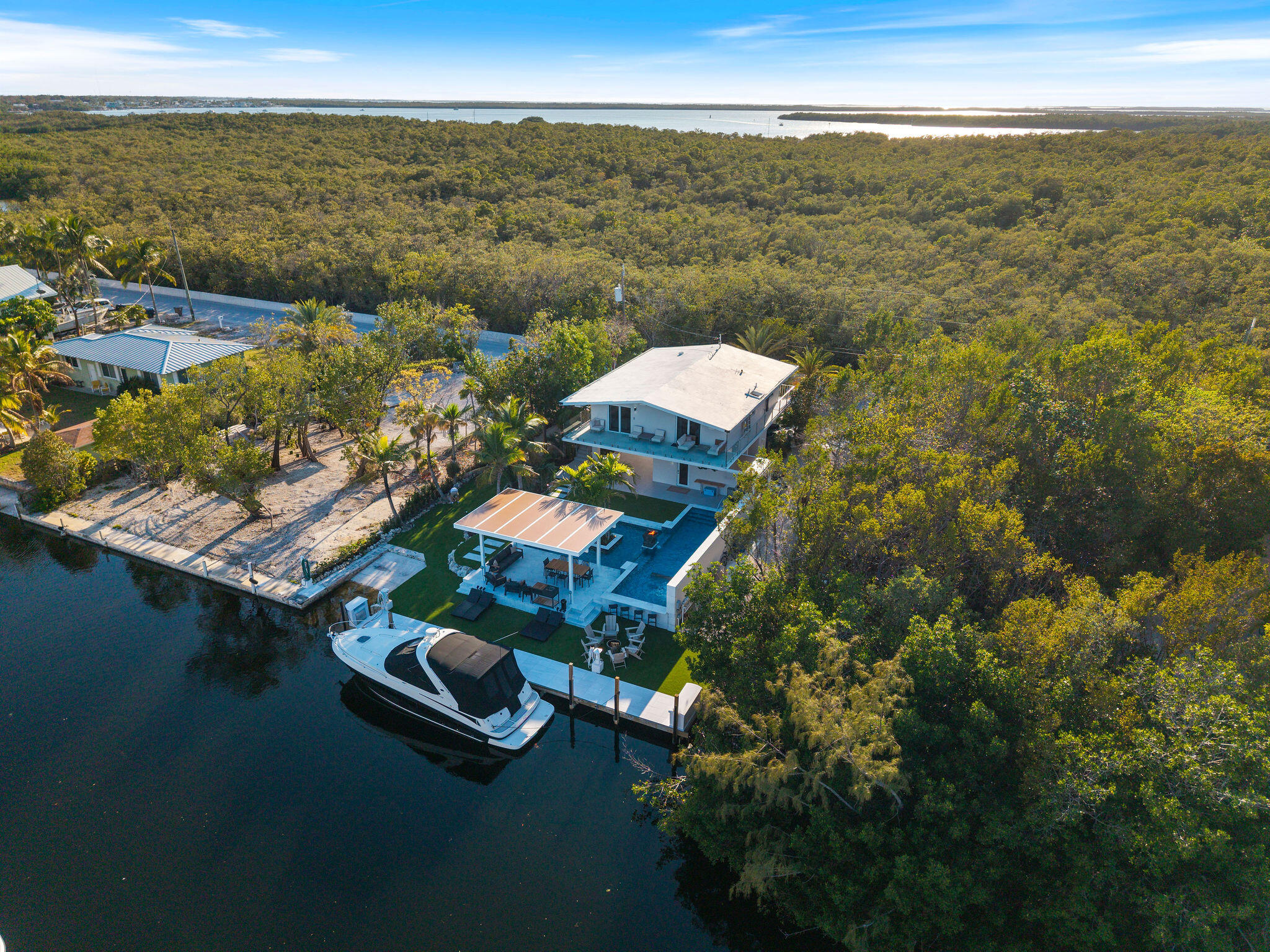 974 Shaw Drive Key Largo, FL 33037 - Photo 80 of 84 an aerial view of a house with a ocean view