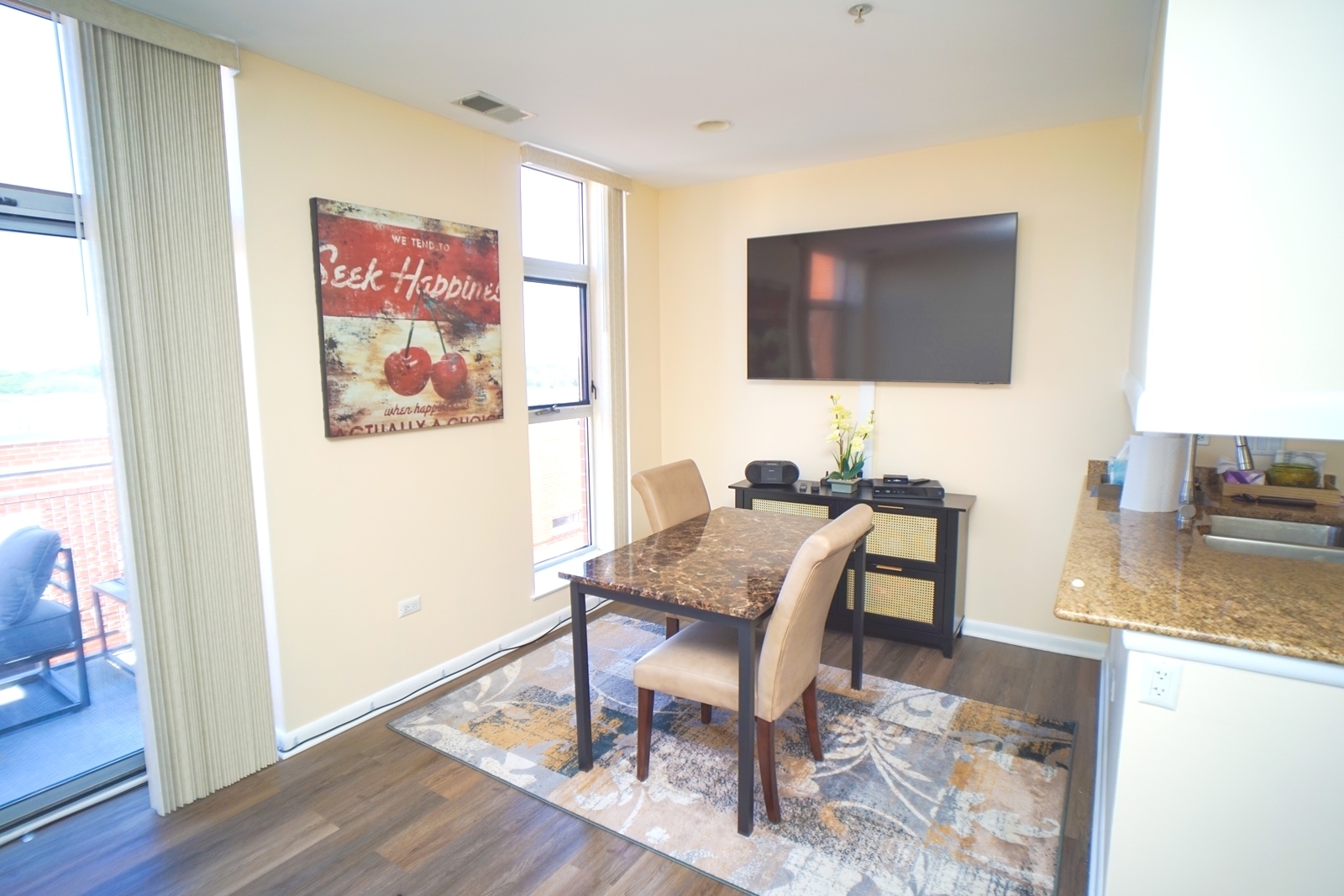 1222 Chicago Avenue, Unit 705 Evanston, IL 60202 - Photo 12 of 33 a workspace with furniture and wooden floor