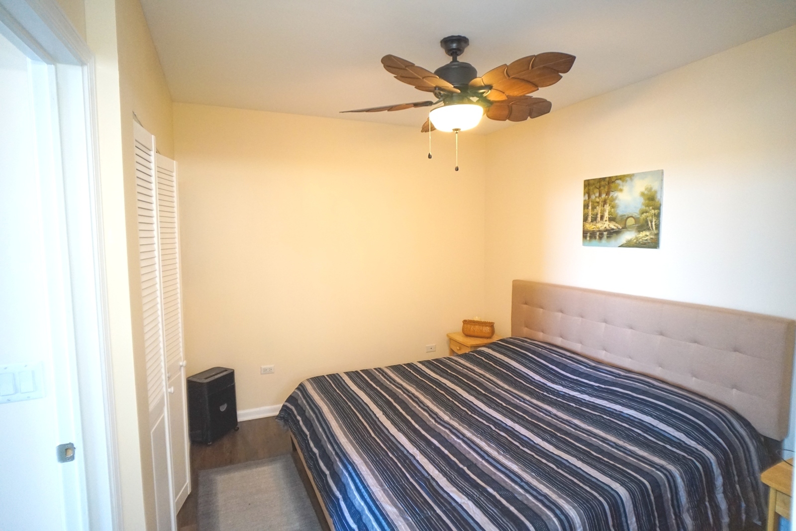 1222 Chicago Avenue, Unit 705 Evanston, IL 60202 - Photo 13 of 33 a bedroom with a bed and a painting on the wall