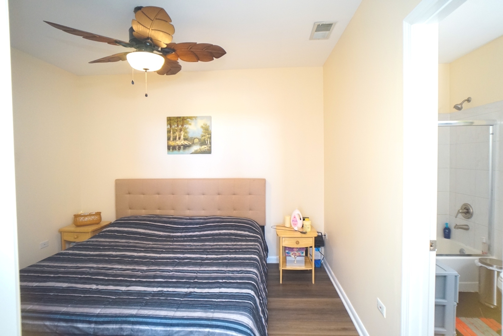 1222 Chicago Avenue, Unit 705 Evanston, IL 60202 - Photo 14 of 33 a bedroom with a bed and a chandelier