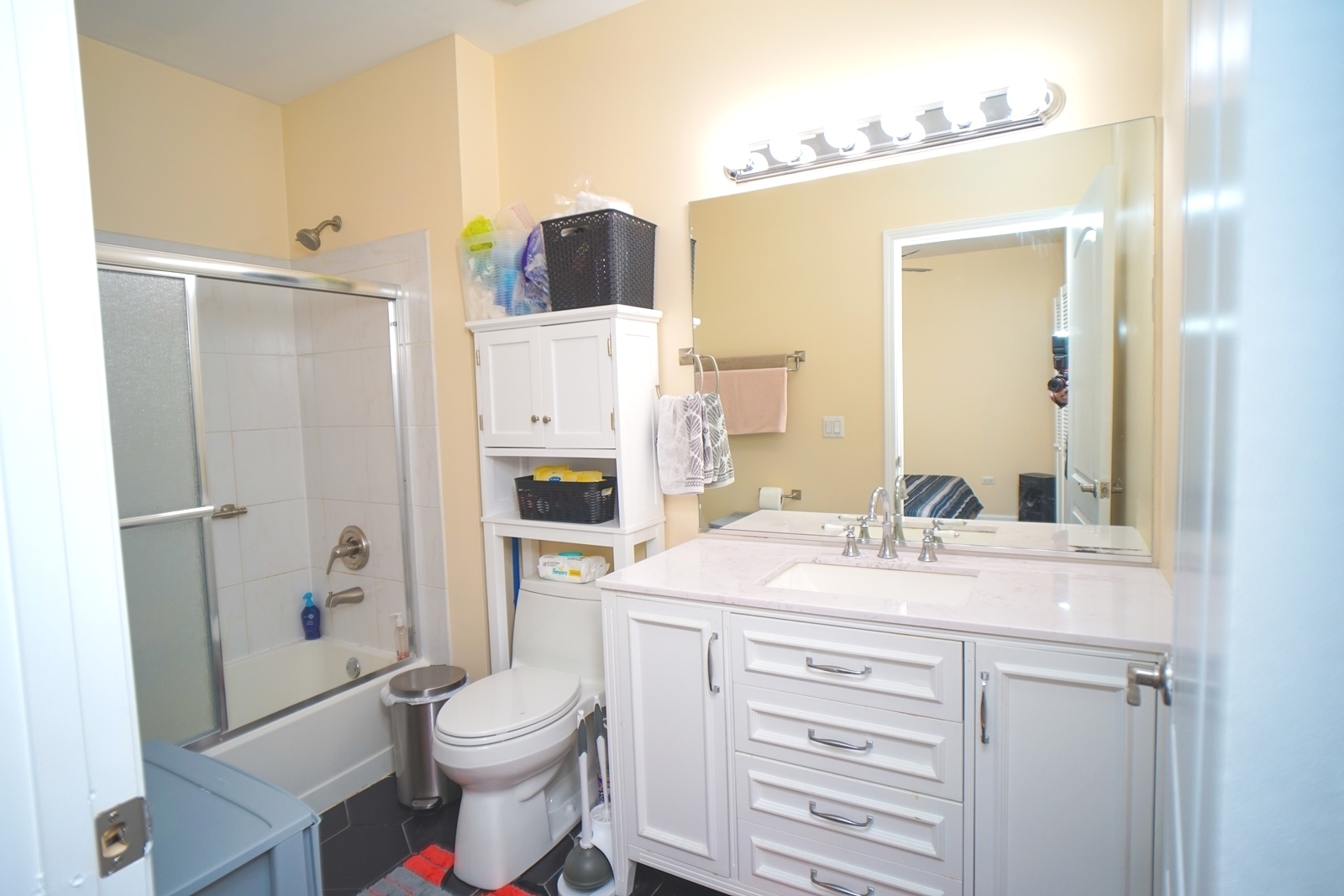 1222 Chicago Avenue, Unit 705 Evanston, IL 60202 - Photo 17 of 33 a bathroom with a sink toilet vanity and shower
