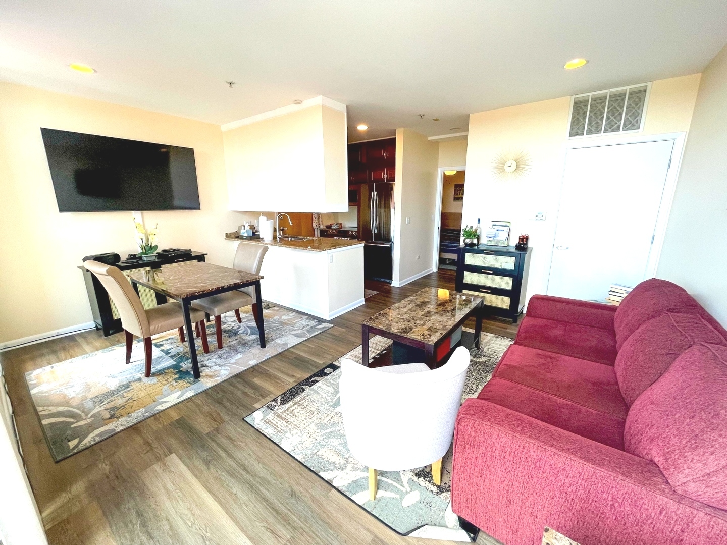 1222 Chicago Avenue, Unit 705 Evanston, IL 60202 - Photo 18 of 33 a living room with furniture and a flat screen tv