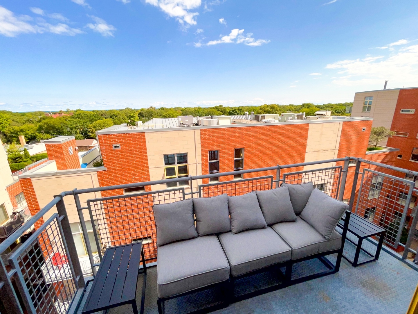 1222 Chicago Avenue, Unit 705 Evanston, IL 60202 - Photo 4 of 33 a balcony with furniture and city view