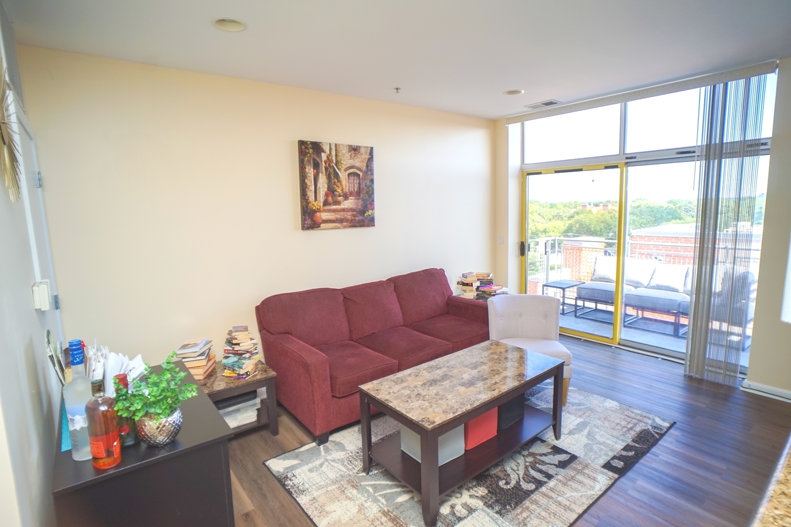 1222 Chicago Avenue, Unit 705 Evanston, IL 60202 - Photo 10 of 33 a living room with furniture and a large window