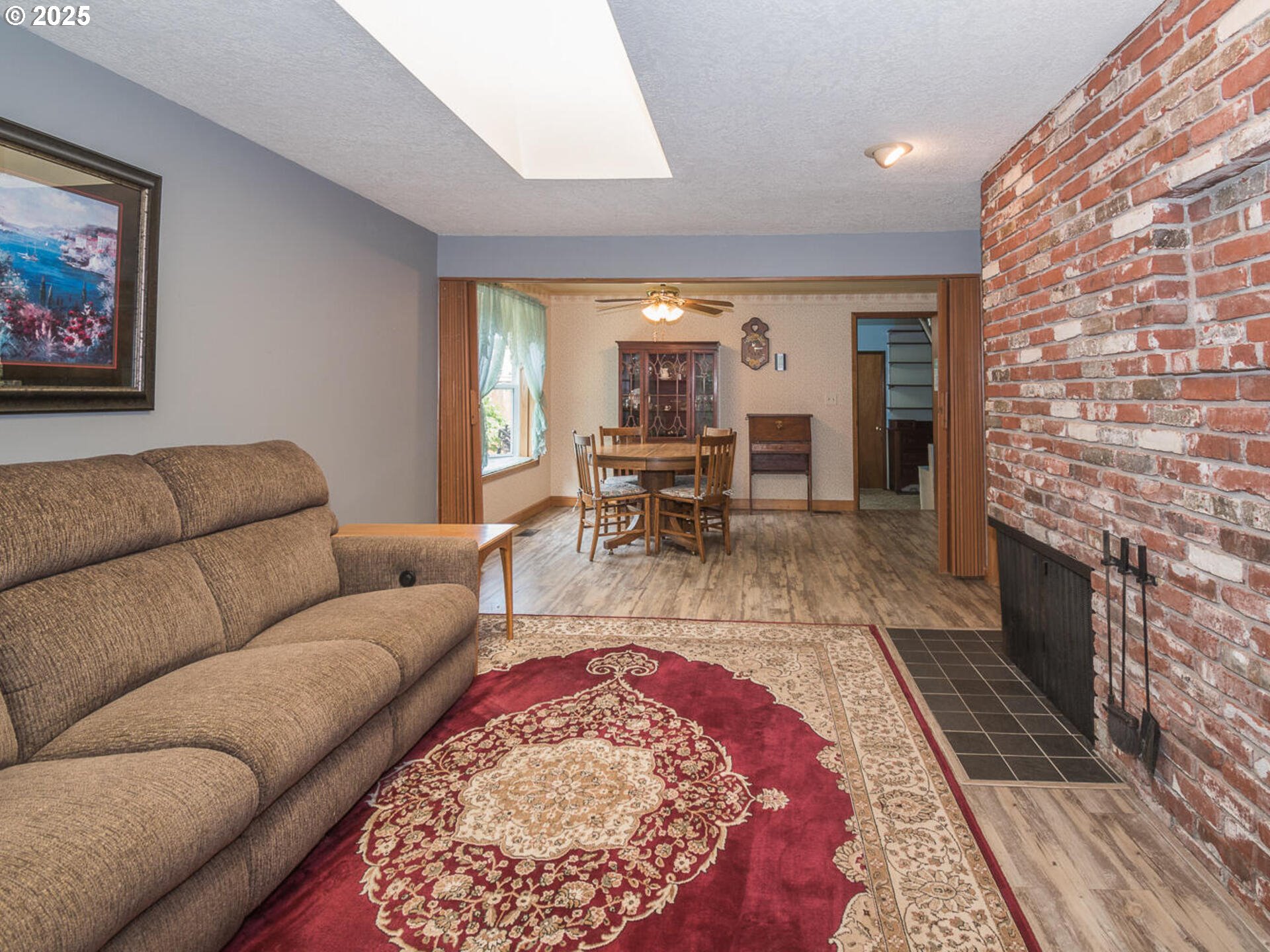 19838 Northeast Wasco Street Portland, OR 97230 - Photo 13 of 42 a living room with furniture and a fireplace
