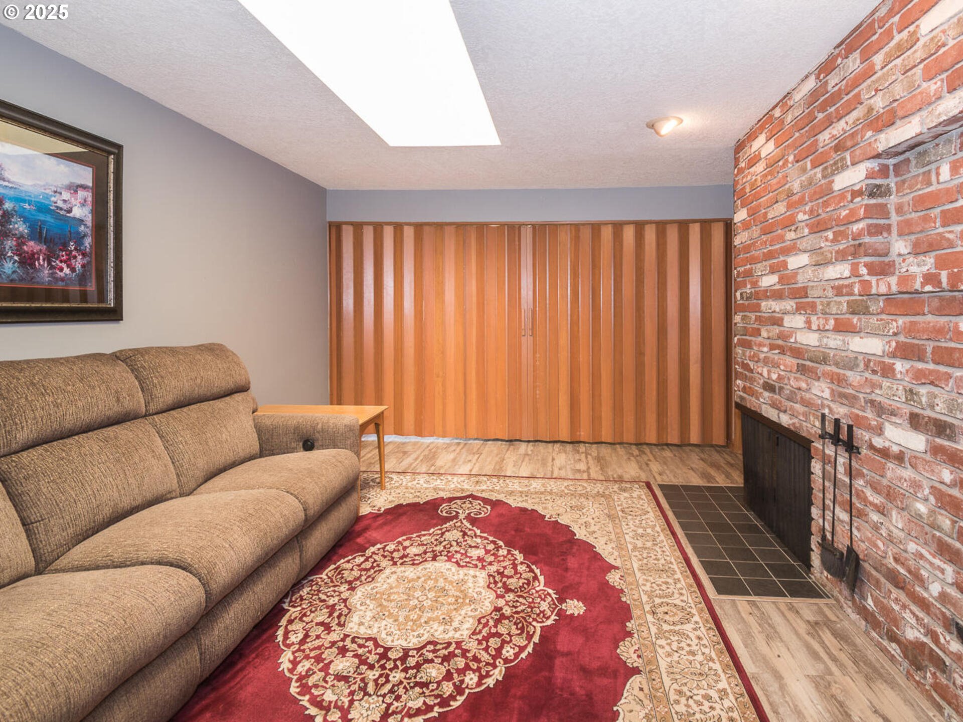 19838 Northeast Wasco Street Portland, OR 97230 - Photo 14 of 42 a living room with a couch and a rug