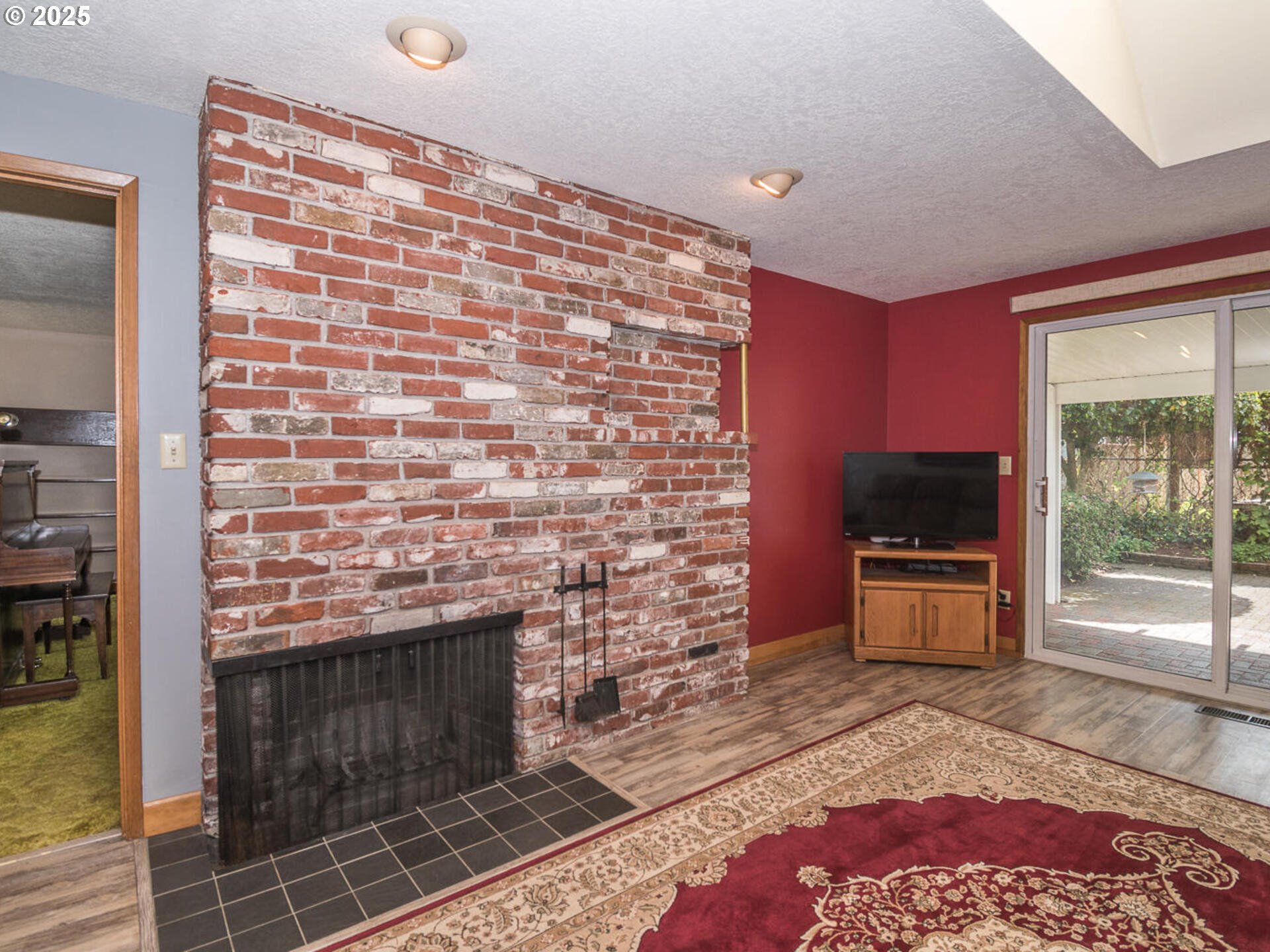 19838 Northeast Wasco Street Portland, OR 97230 - Photo 15 of 42 a living room with a couch and a fireplace