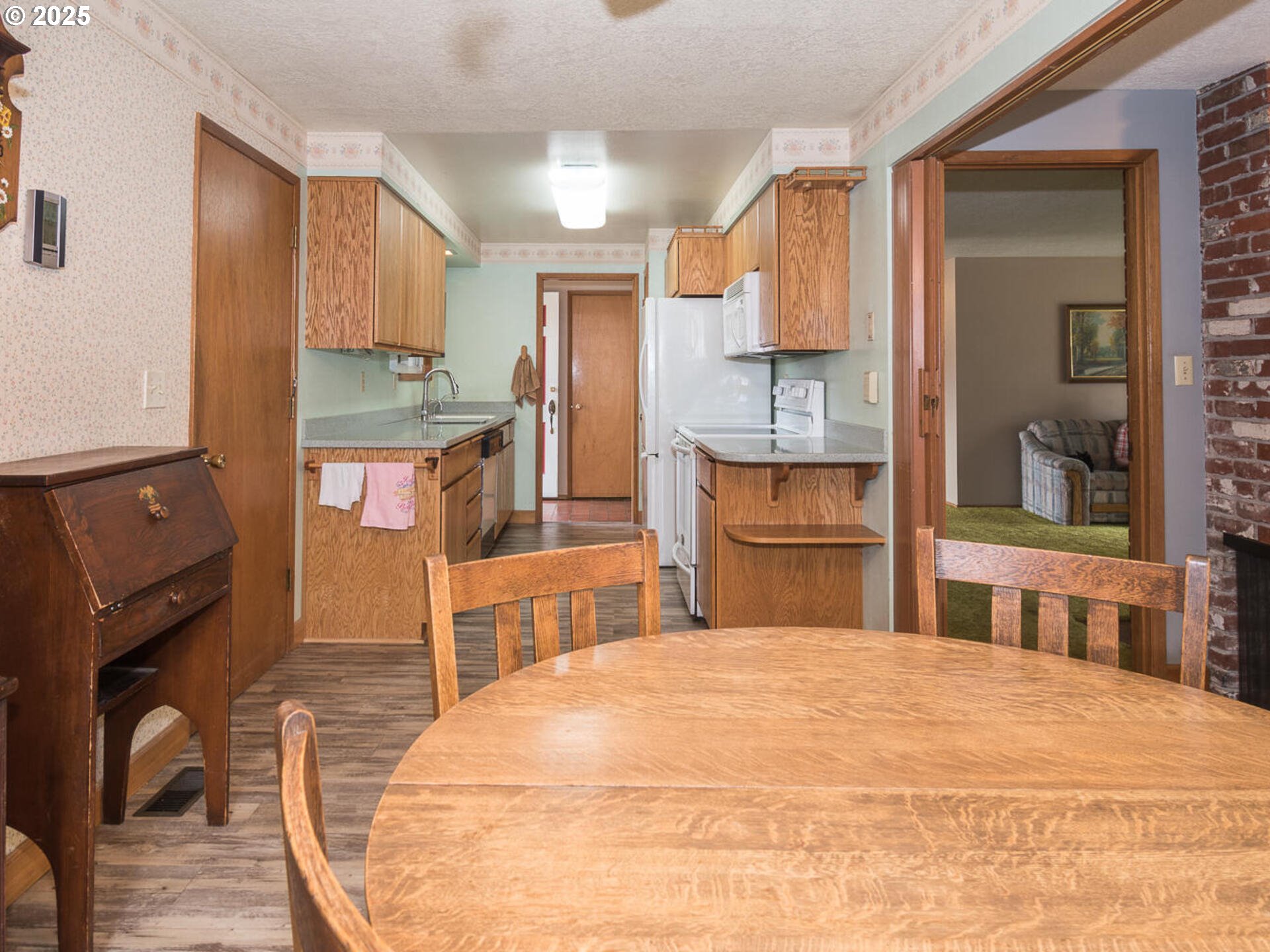 19838 Northeast Wasco Street Portland, OR 97230 - Photo 17 of 42 a bedroom with a bed and a flat tv screen