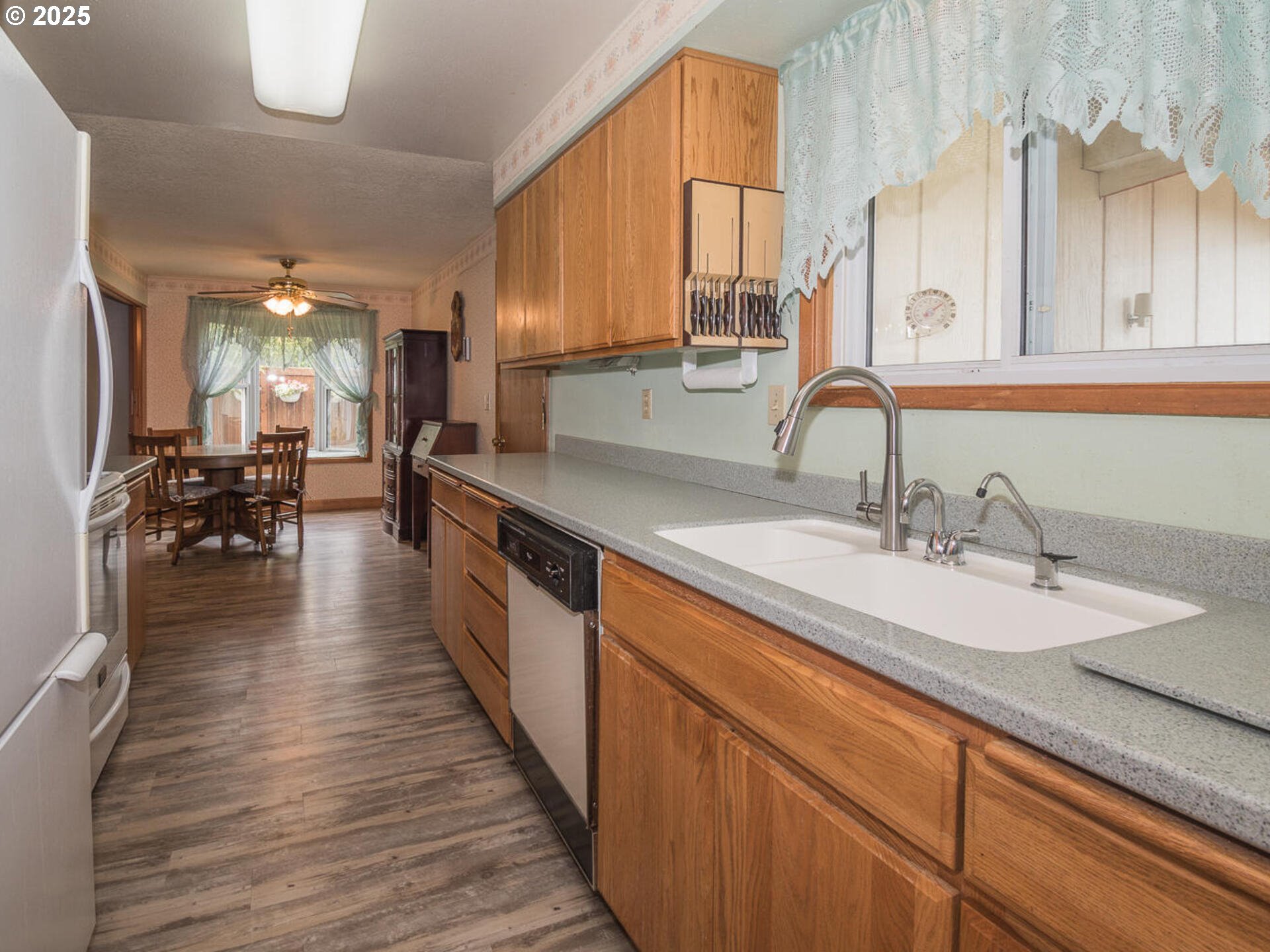 19838 Northeast Wasco Street Portland, OR 97230 - Photo 19 of 42 a large kitchen with kitchen island a sink wooden floor and counter space