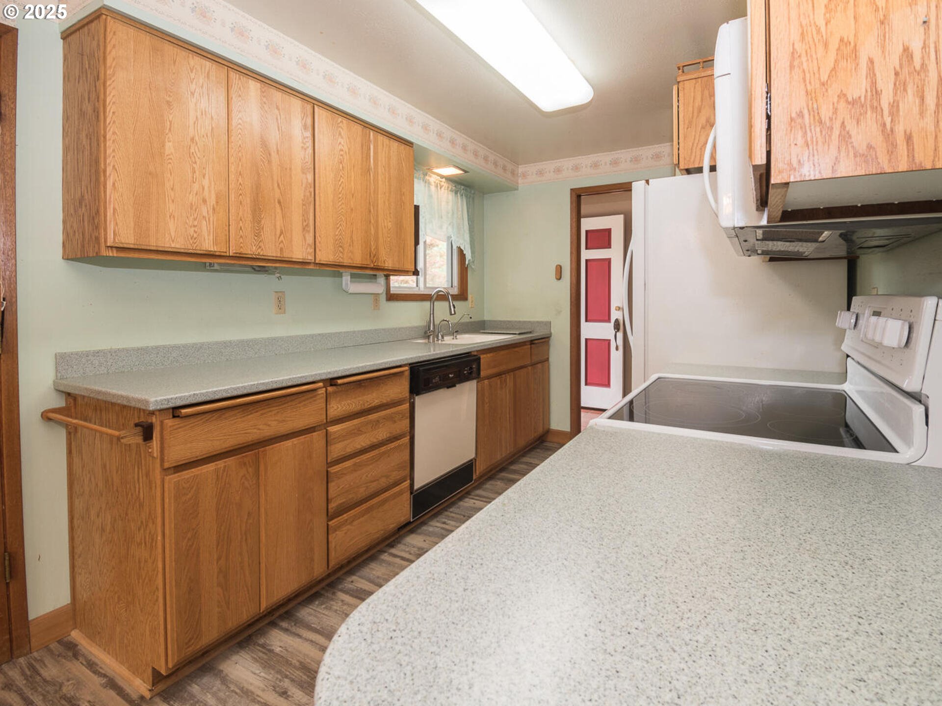 19838 Northeast Wasco Street Portland, OR 97230 - Photo 20 of 42 a kitchen with stainless steel appliances granite countertop a sink a stove and a refrigerator