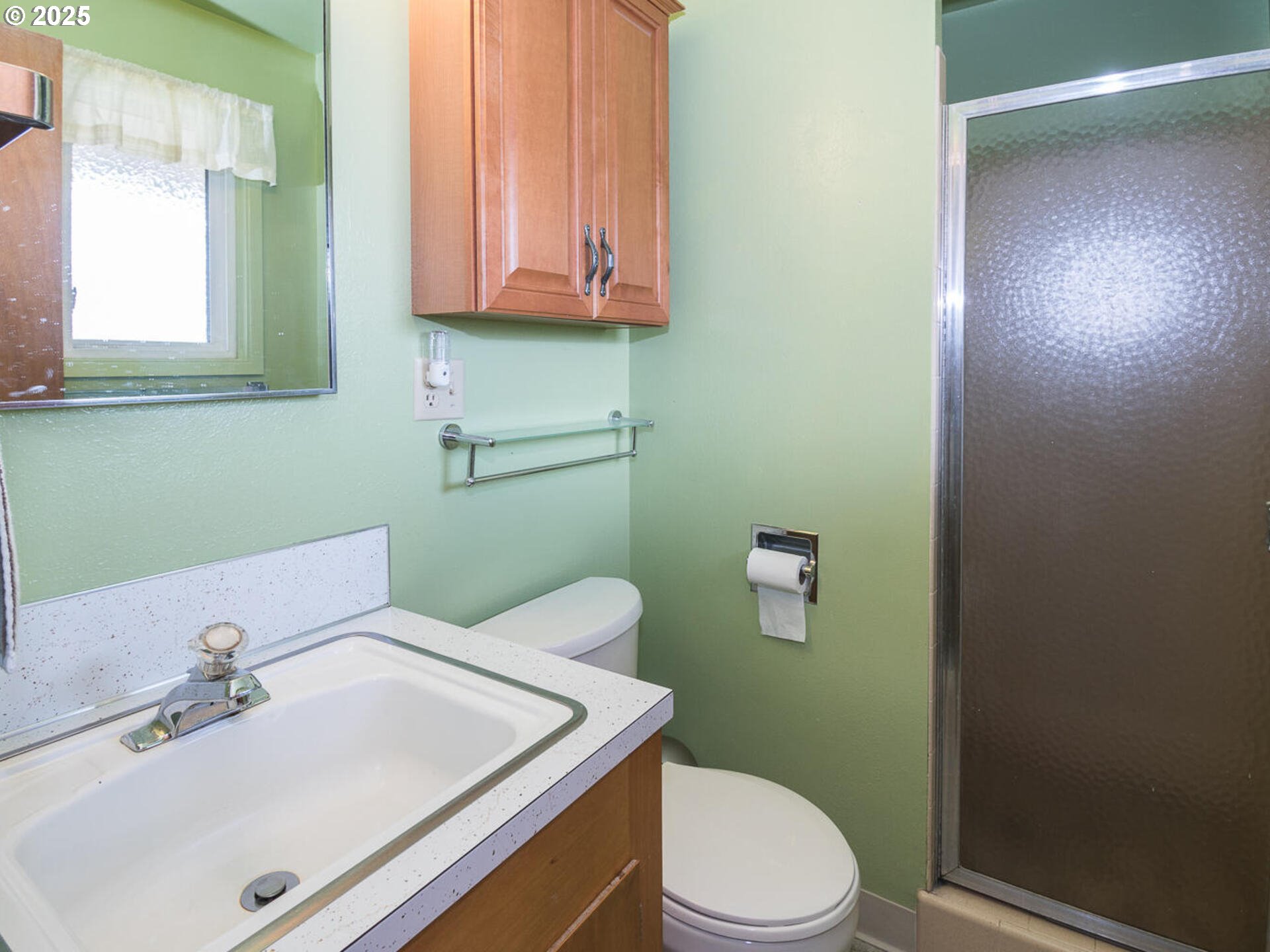 19838 Northeast Wasco Street Portland, OR 97230 - Photo 27 of 42 a bathroom with a sink a toilet and mirror