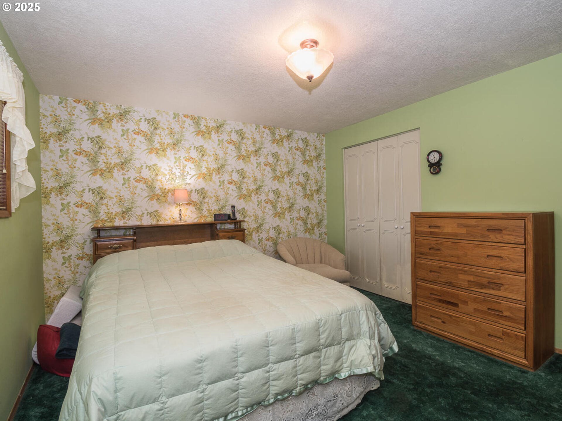 19838 Northeast Wasco Street Portland, OR 97230 - Photo 28 of 42 a bedroom with a bed and a dresser